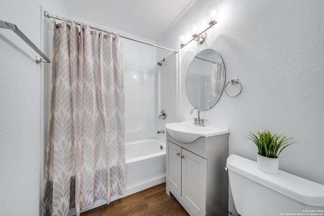 full bathroom featuring vanity, hardwood / wood-style floors, toilet, ornamental molding, and shower / bathtub combination with curtain