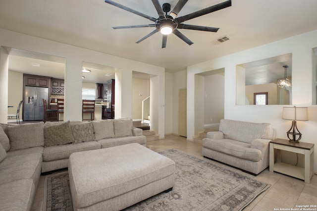 living room with light tile patterned flooring and ceiling fan