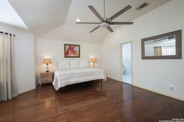 bedroom featuring dark wood-type flooring, vaulted ceiling, ceiling fan, and a textured ceiling