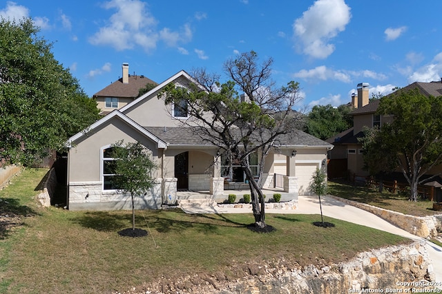 view of front of home featuring a garage and a front lawn