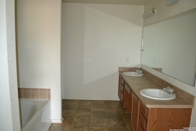 bathroom with vanity and a bathing tub