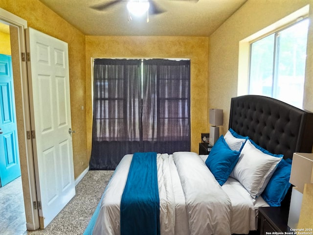 carpeted bedroom featuring a ceiling fan
