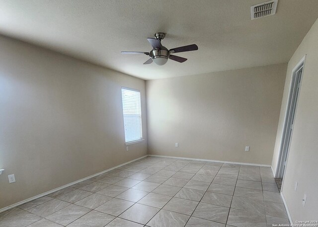 bathroom featuring tile patterned floors, vanity, and walk in shower