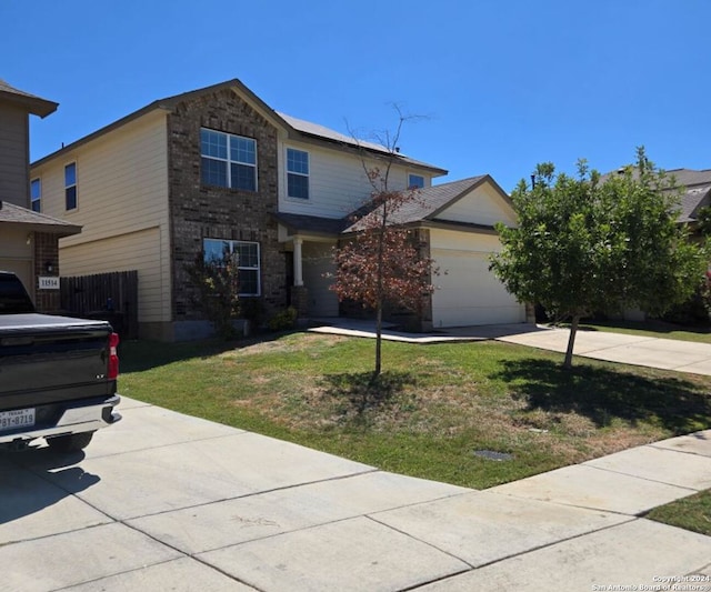 front of property featuring a front lawn and a garage