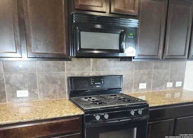 kitchen featuring light stone countertops, dark brown cabinetry, decorative backsplash, and black appliances