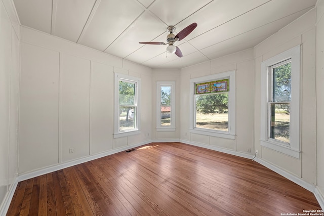 unfurnished room featuring hardwood / wood-style flooring and ceiling fan