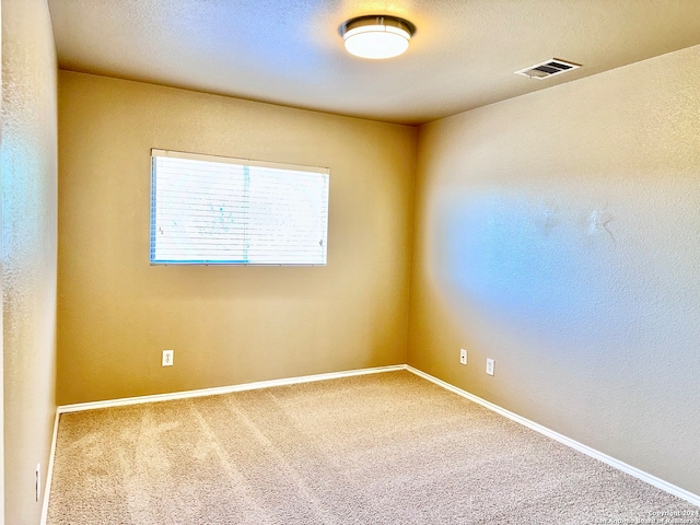 empty room featuring carpet flooring