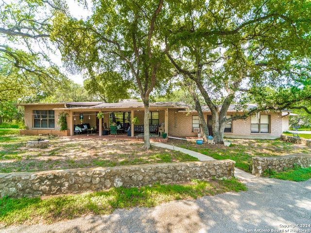 single story home featuring a patio area