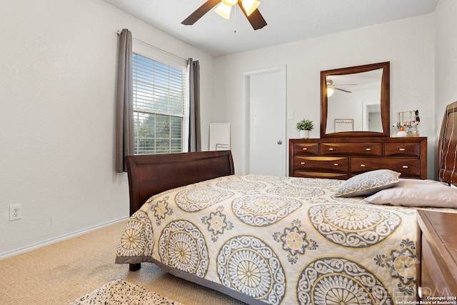 bedroom with ceiling fan and carpet floors