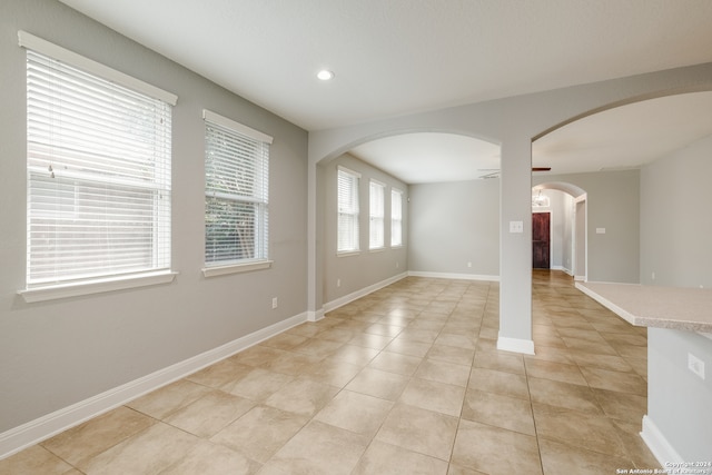 unfurnished room with light tile patterned floors