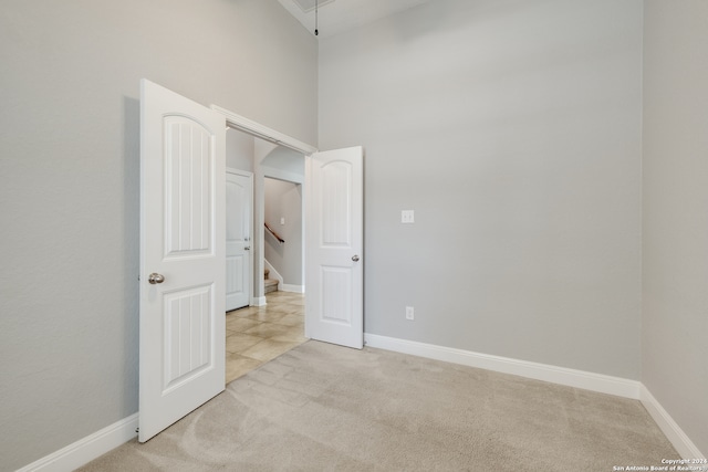 empty room featuring light carpet