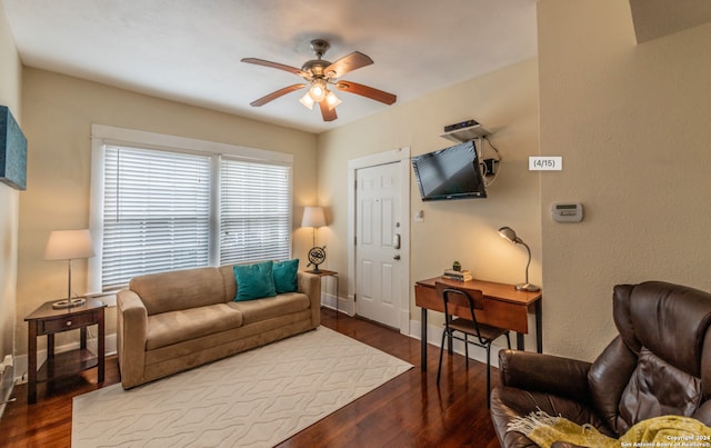 living room featuring ceiling fan and wood-type flooring