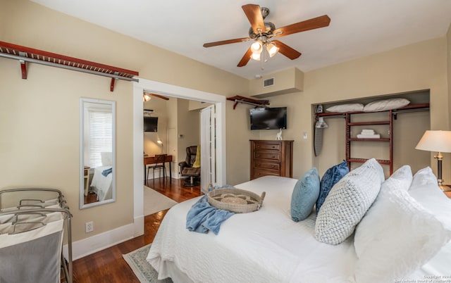 bedroom with dark wood-type flooring and ceiling fan