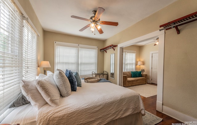 bedroom with hardwood / wood-style floors and ceiling fan