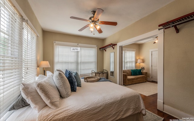 bedroom featuring hardwood / wood-style floors and ceiling fan