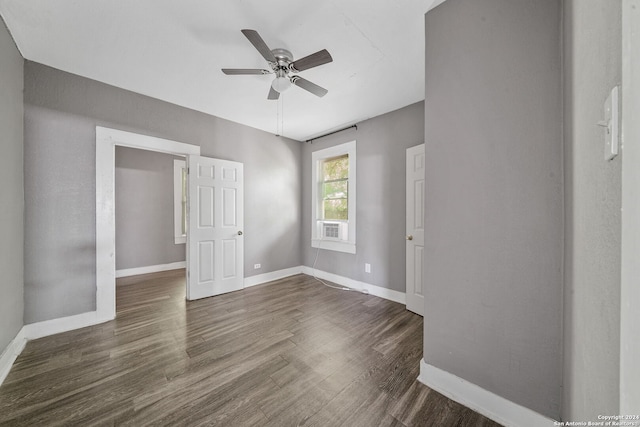 143 Paul St, San Antonio, TX 78203 - empty room featuring baseboards, a ceiling fan, and dark wood-style floors