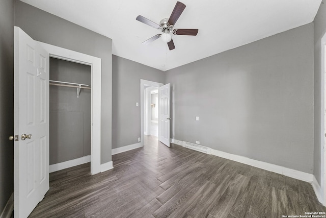 143 Paul St, San Antonio, TX 78203 - unfurnished bedroom featuring baseboards, a ceiling fan, wood finished floors, and a closet
