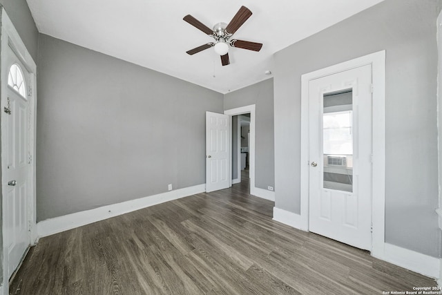 143 Paul St, San Antonio, TX 78203 - unfurnished bedroom with wood finished floors, a ceiling fan, and baseboards