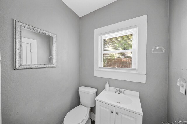 143 Paul St, San Antonio, TX 78203 - half bathroom featuring vanity and toilet