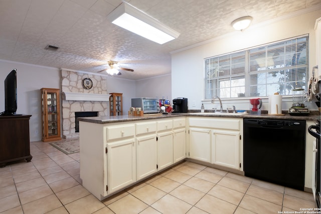 kitchen with black dishwasher, light tile patterned flooring, kitchen peninsula, a stone fireplace, and ceiling fan