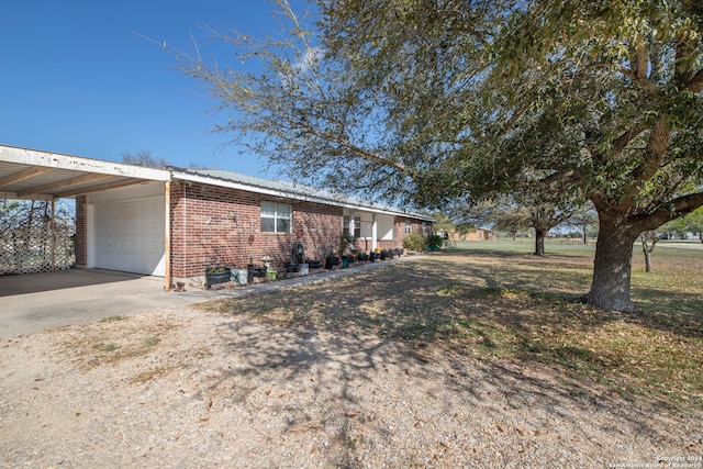 exterior space featuring a carport and a garage