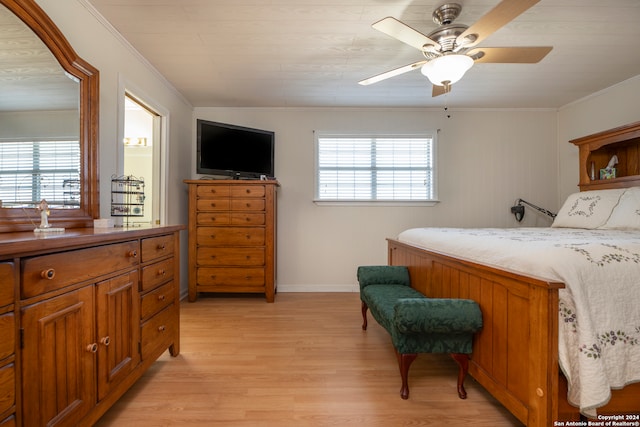 bedroom with ornamental molding, light hardwood / wood-style floors, and ceiling fan