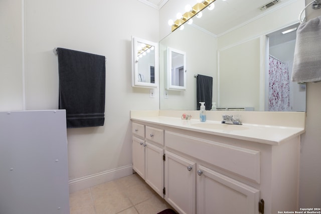 bathroom featuring vanity, tile patterned flooring, and ornamental molding