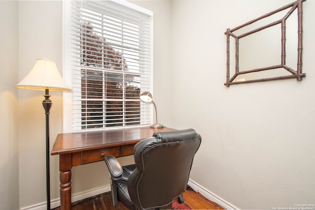 office with dark hardwood / wood-style floors