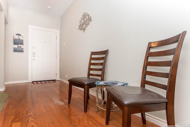 interior space featuring vaulted ceiling and hardwood / wood-style flooring