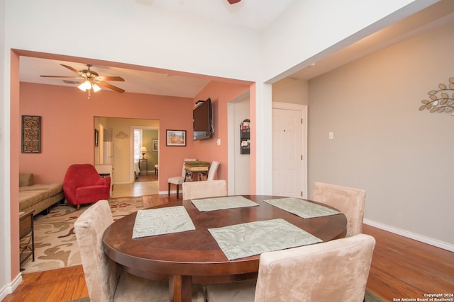 dining room featuring wood-type flooring and ceiling fan