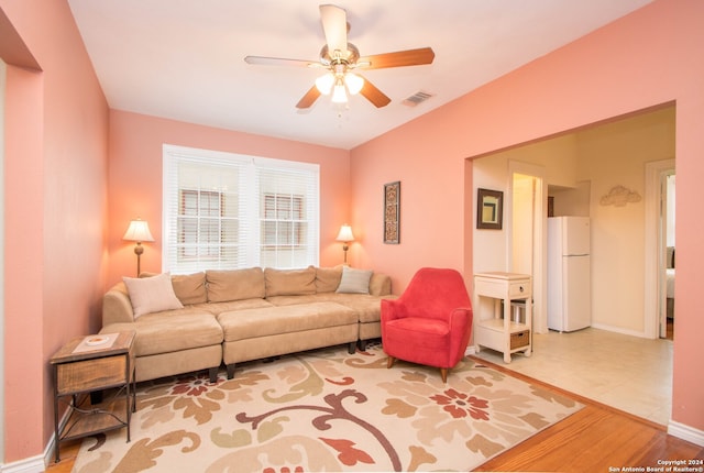 living room with ceiling fan and wood-type flooring