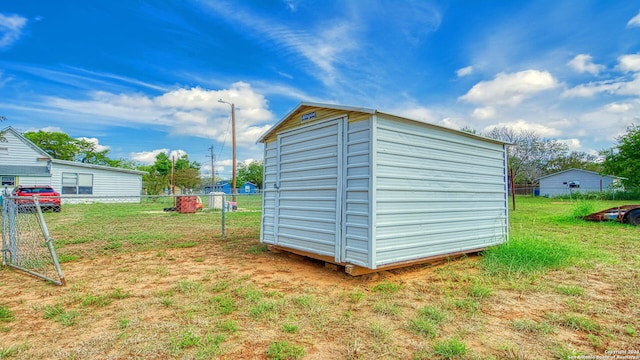 view of outdoor structure featuring a lawn