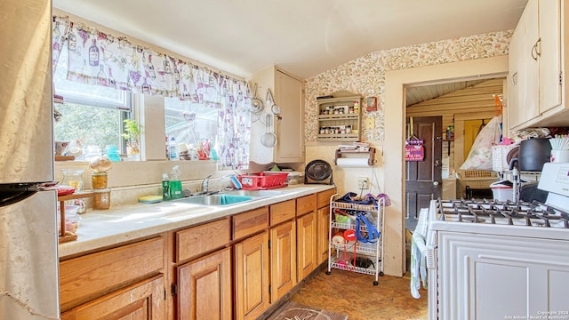 bathroom with vaulted ceiling and sink