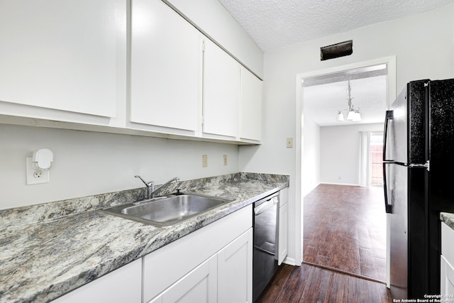 kitchen with white cabinetry, black appliances, a textured ceiling, and dark hardwood / wood-style floors