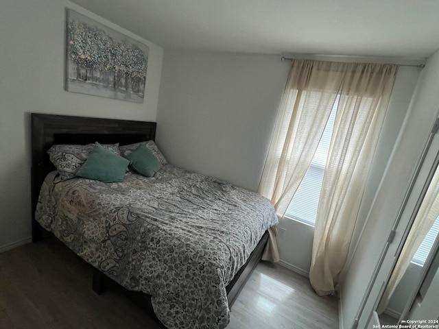 bedroom with light wood-type flooring