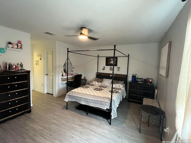 bedroom featuring wood-type flooring and ceiling fan