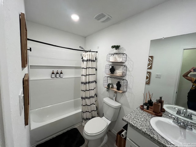 full bathroom featuring shower / bath combo, toilet, and vanity