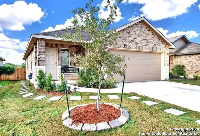 view of front of home featuring a garage and a front lawn