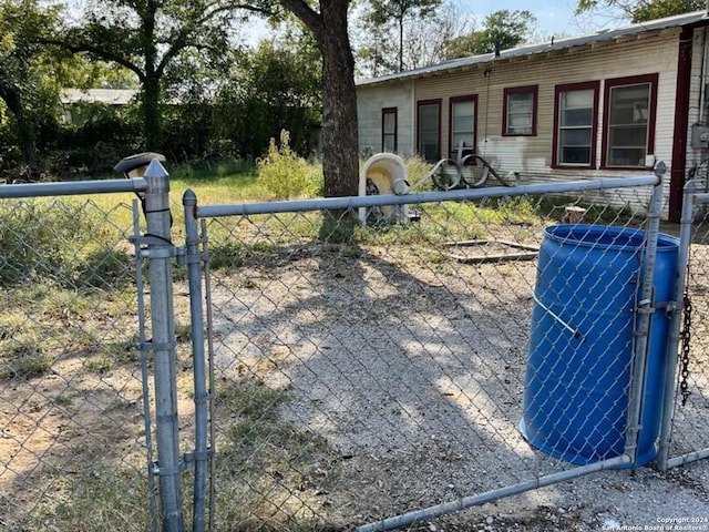 exterior space with a gate and fence