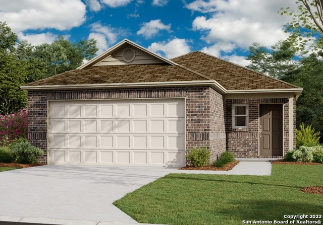 view of front of property with a garage and a front yard