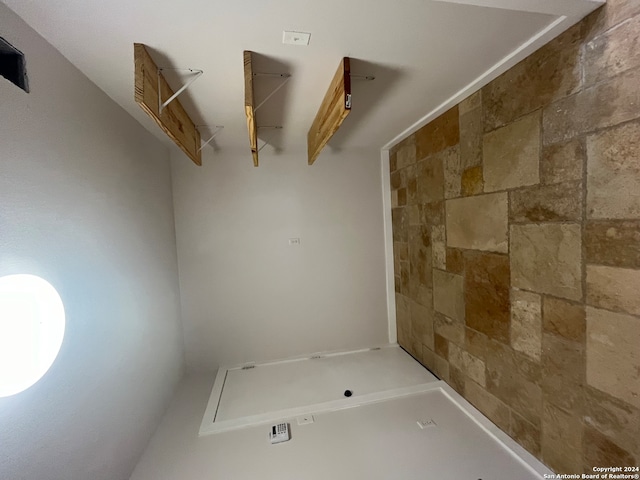 bathroom featuring walk in shower