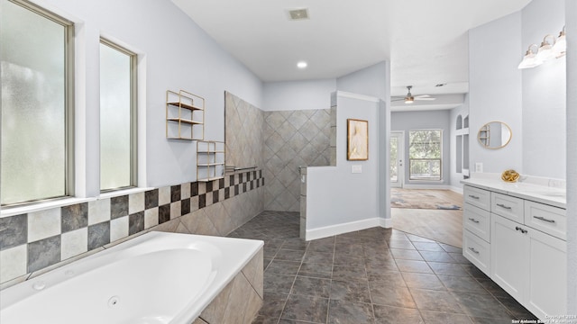 bathroom featuring tile patterned floors, ceiling fan, vanity, and separate shower and tub