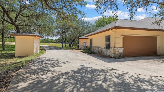 view of property exterior with a garage