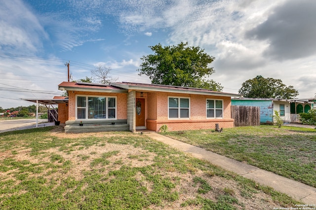 ranch-style house with a front yard