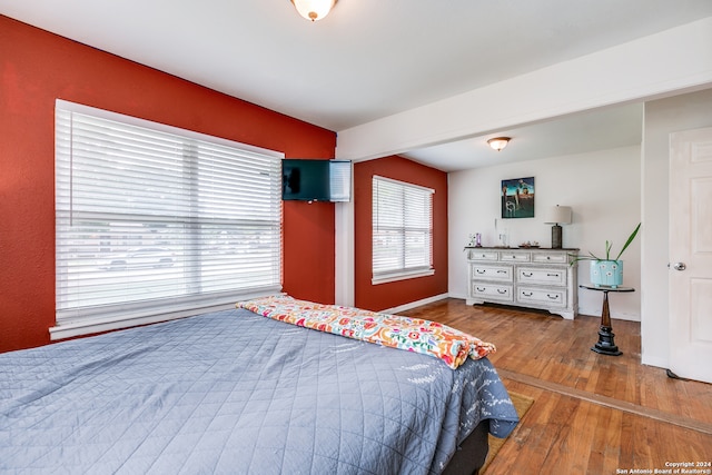 bedroom with hardwood / wood-style floors