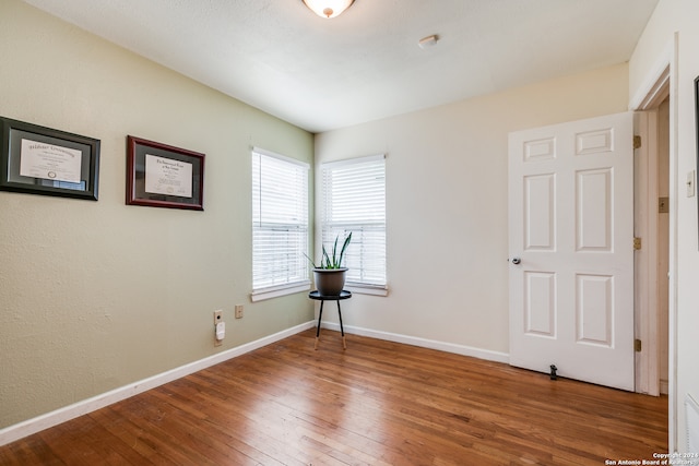 spare room featuring hardwood / wood-style floors