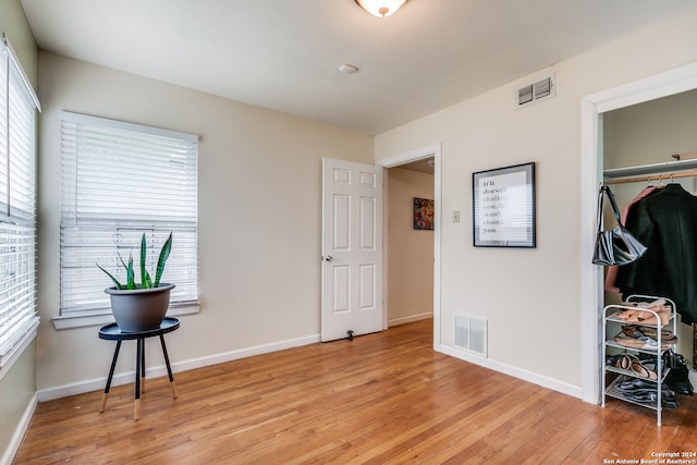 bedroom featuring a closet and light hardwood / wood-style floors