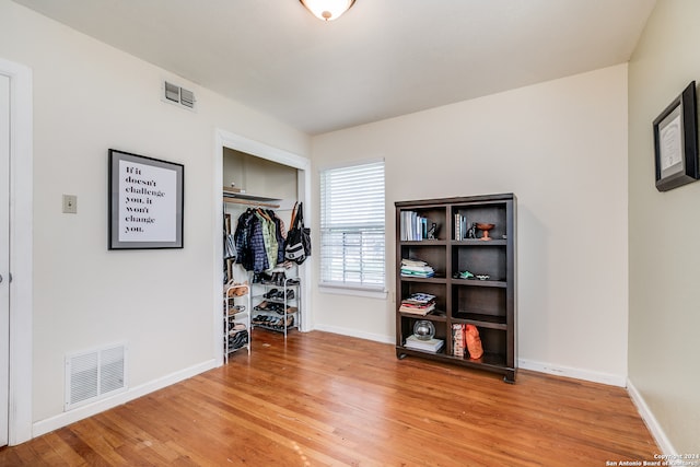 bedroom featuring a closet and wood-type flooring