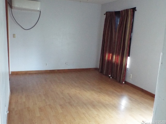 spare room featuring light wood-type flooring