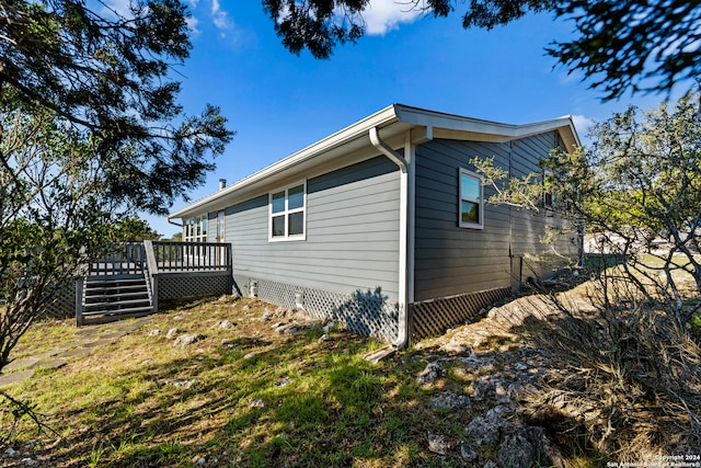 view of side of property with a deck